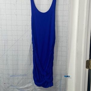 Blue fitted tank dress with tie knot at the bottom.